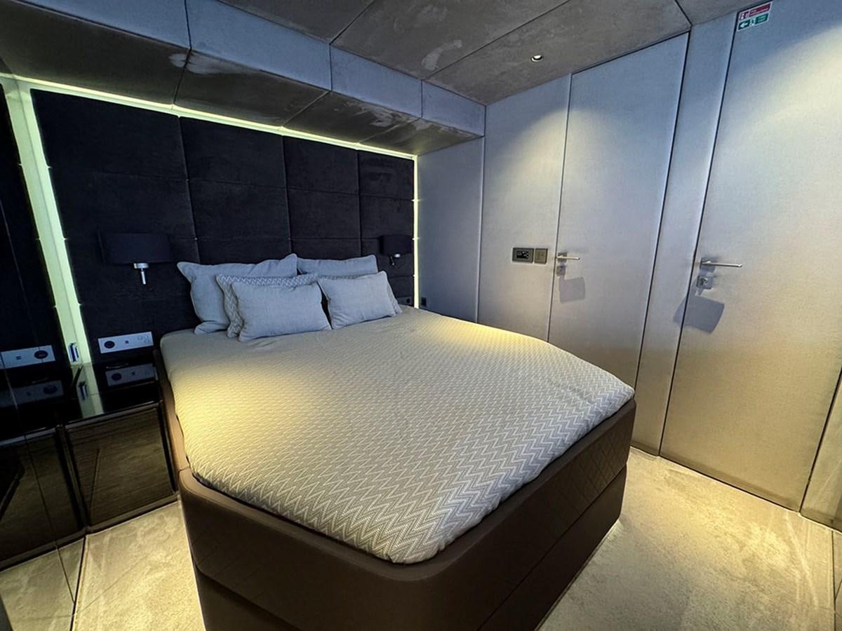 a bed in a room aboard NAOMA Yacht for Sale