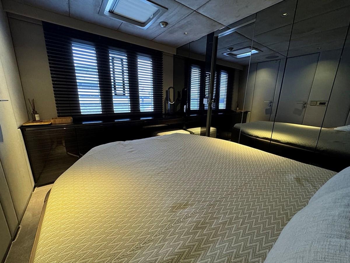 a room with a bed and a piano aboard NAOMA Yacht for Sale