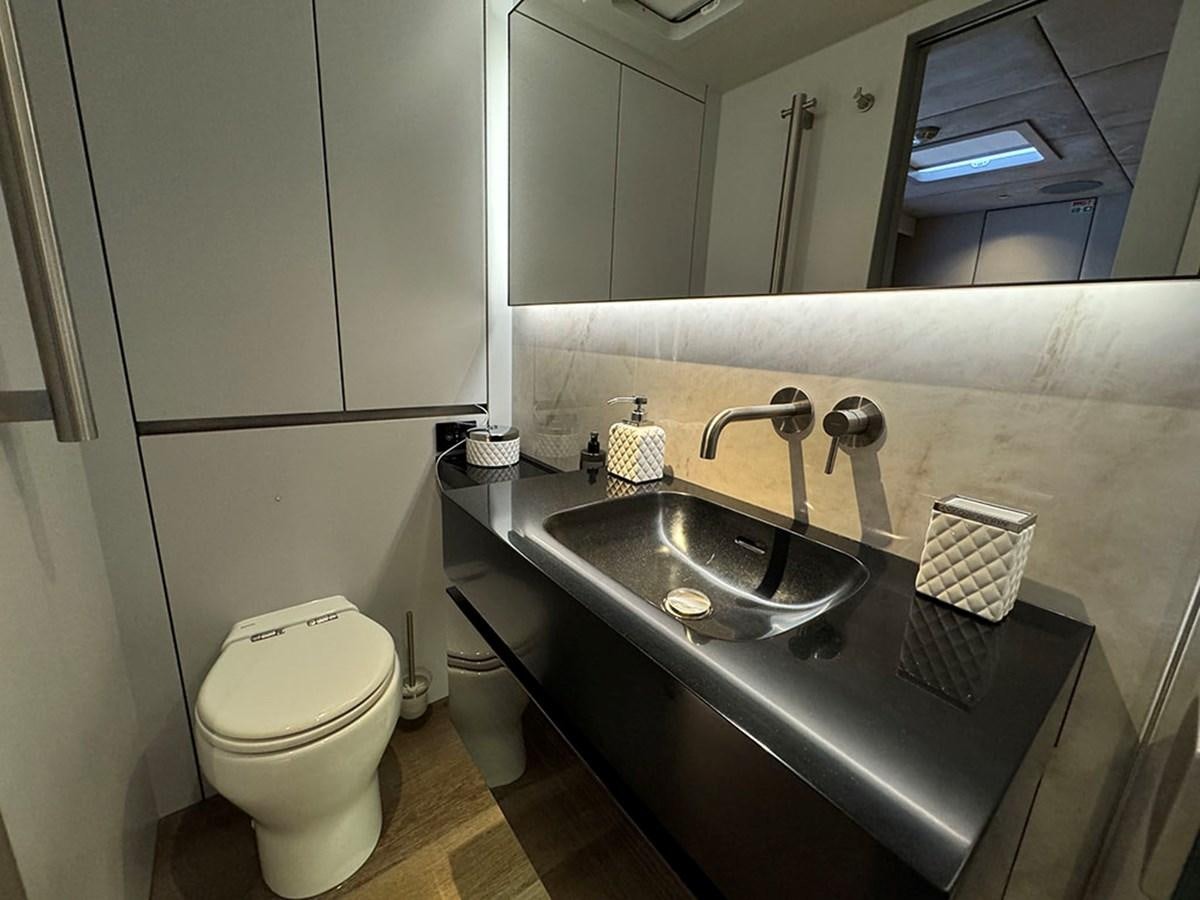 a bathroom with a sink and a toilet aboard NAOMA Yacht for Sale