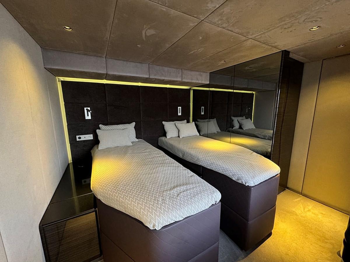 a room with a couple of beds aboard NAOMA Yacht for Sale