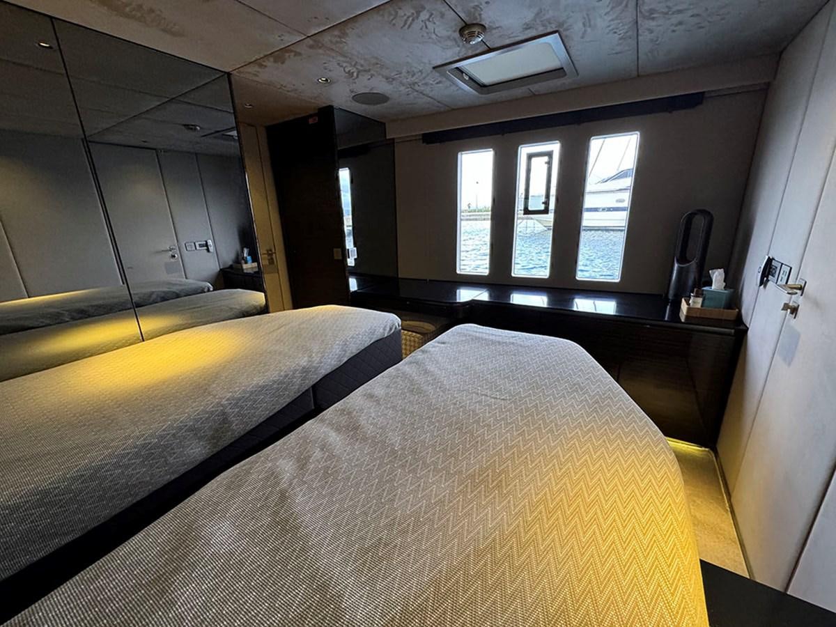 a room with two beds aboard NAOMA Yacht for Sale