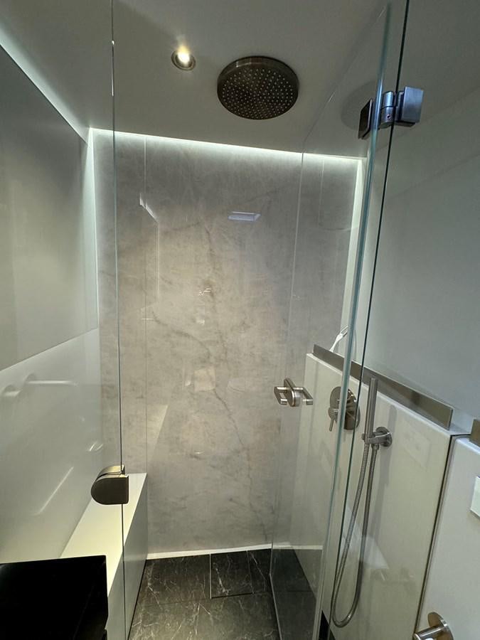 a shower with a glass door aboard NAOMA Yacht for Sale