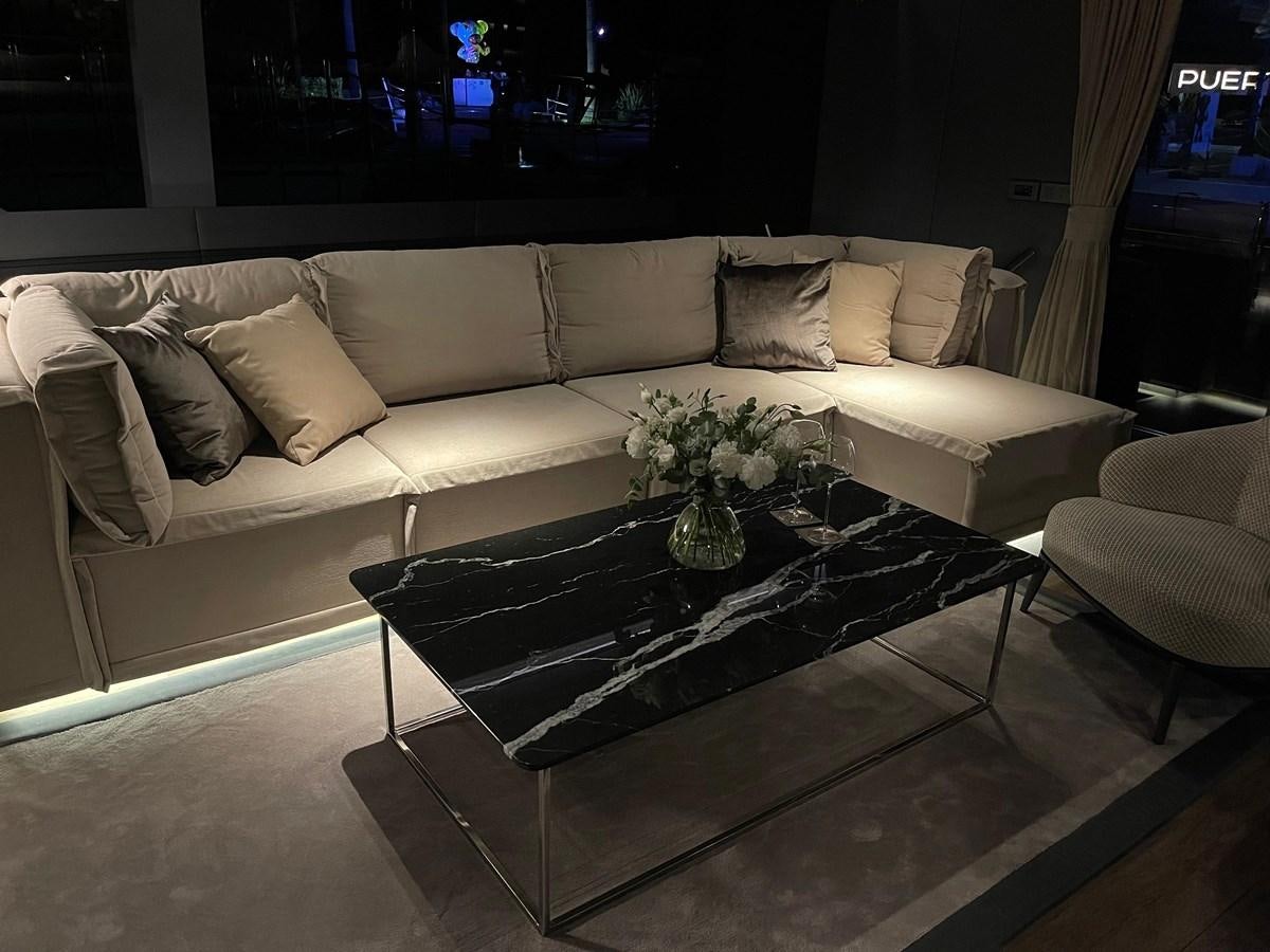 a couch with a coffee table aboard NAOMA Yacht for Sale