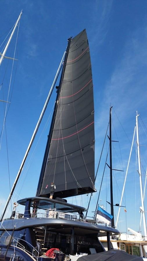 a sailboat on a dock aboard NAOMA Yacht for Sale