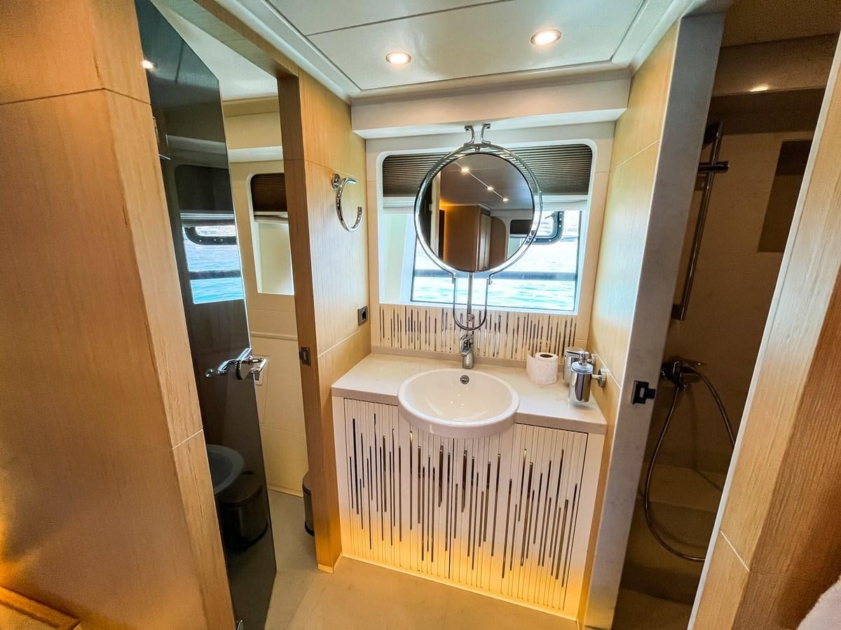 a bathroom with a large mirror aboard SAADET SULTAN Yacht for Sale