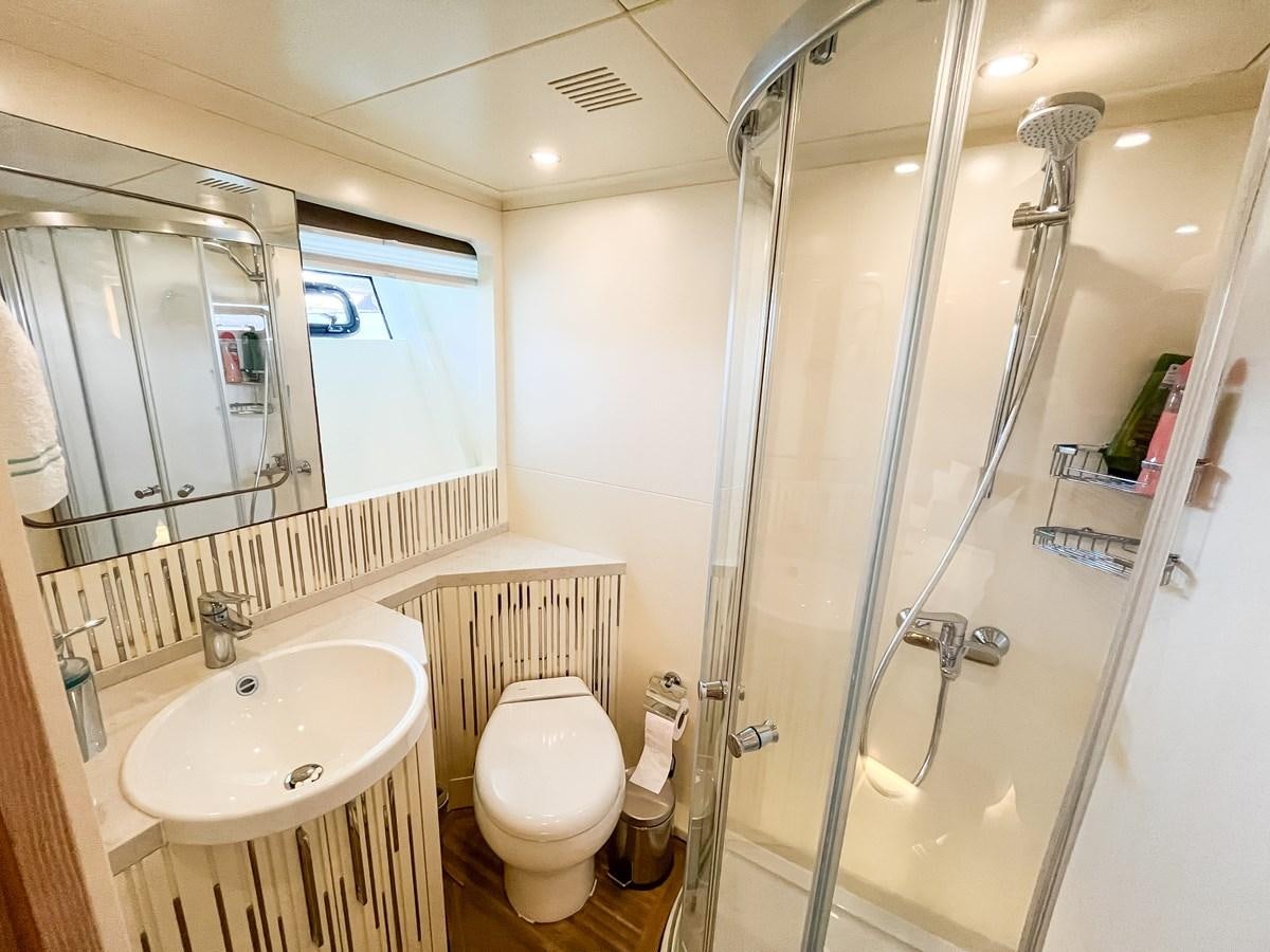 a bathroom with a glass shower aboard SAADET SULTAN Yacht for Sale