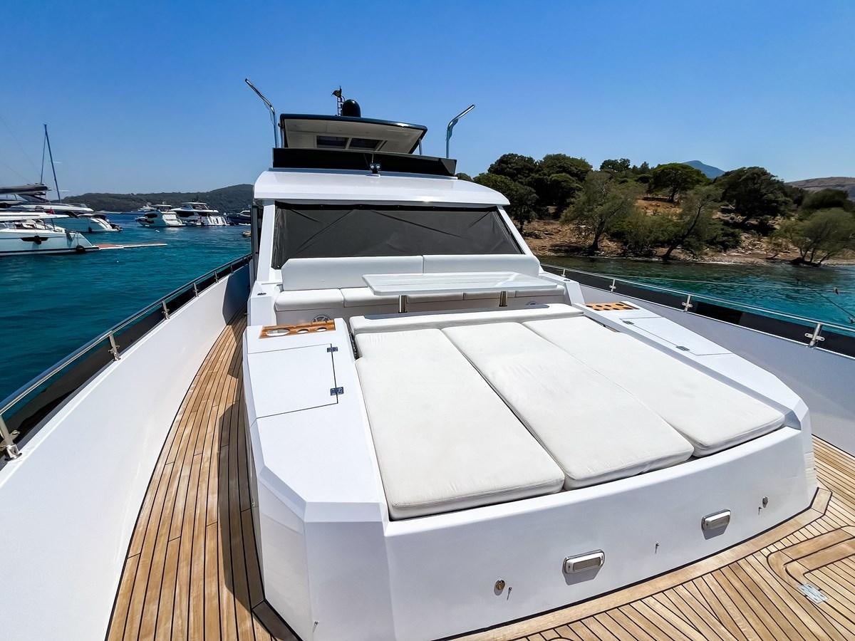 a white yacht docked at a pier aboard SAADET SULTAN Yacht for Sale