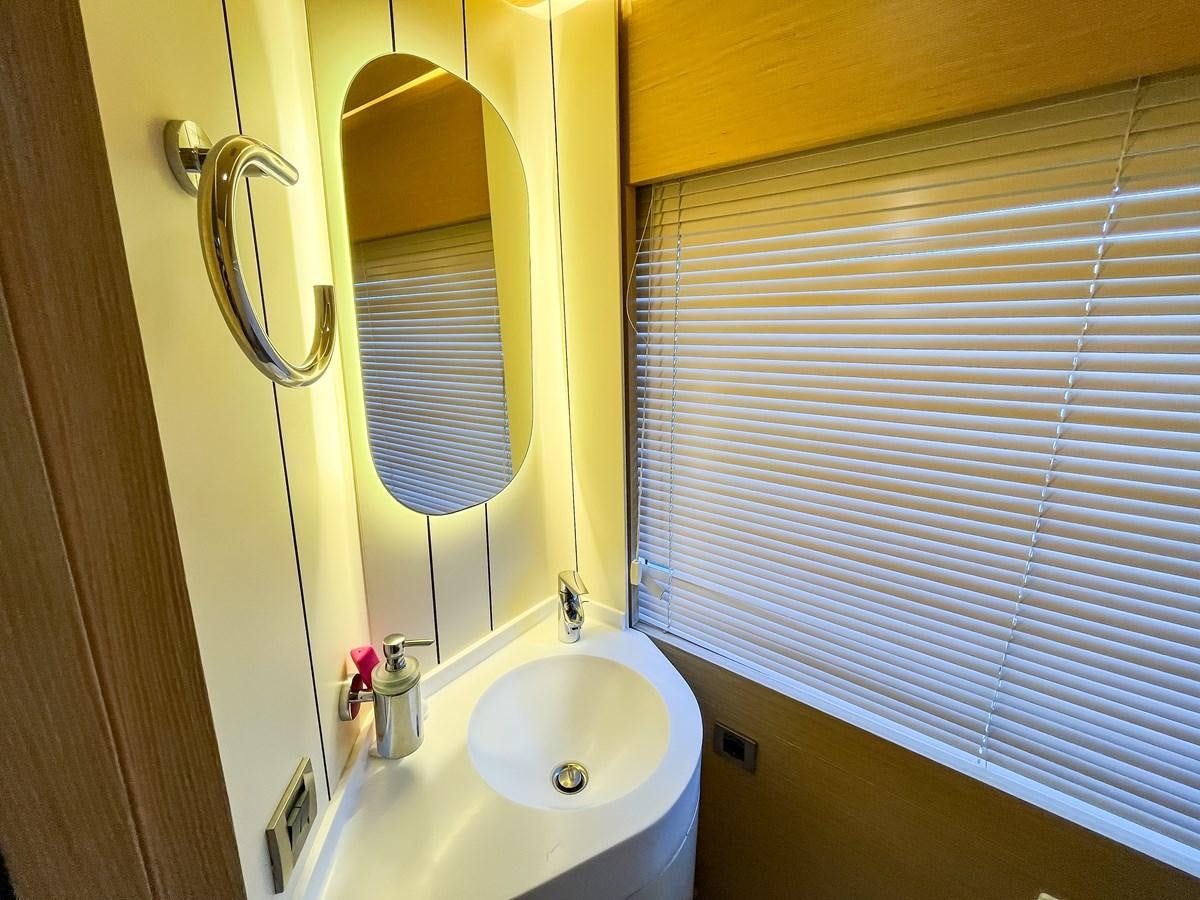 a bathroom with a sink and a mirror aboard SAADET SULTAN Yacht for Sale