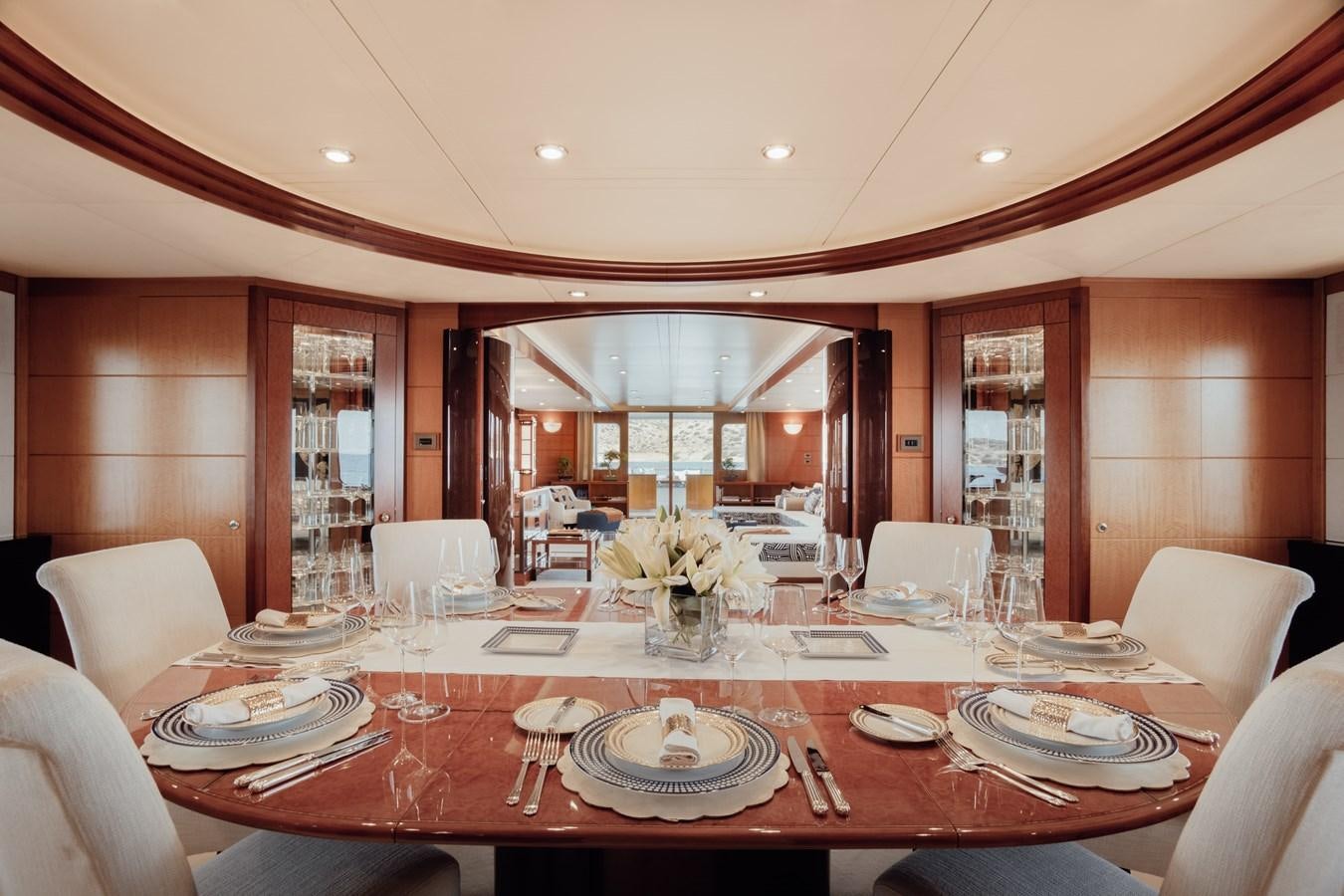 a dining room with a table set aboard HERCULES Yacht for Sale