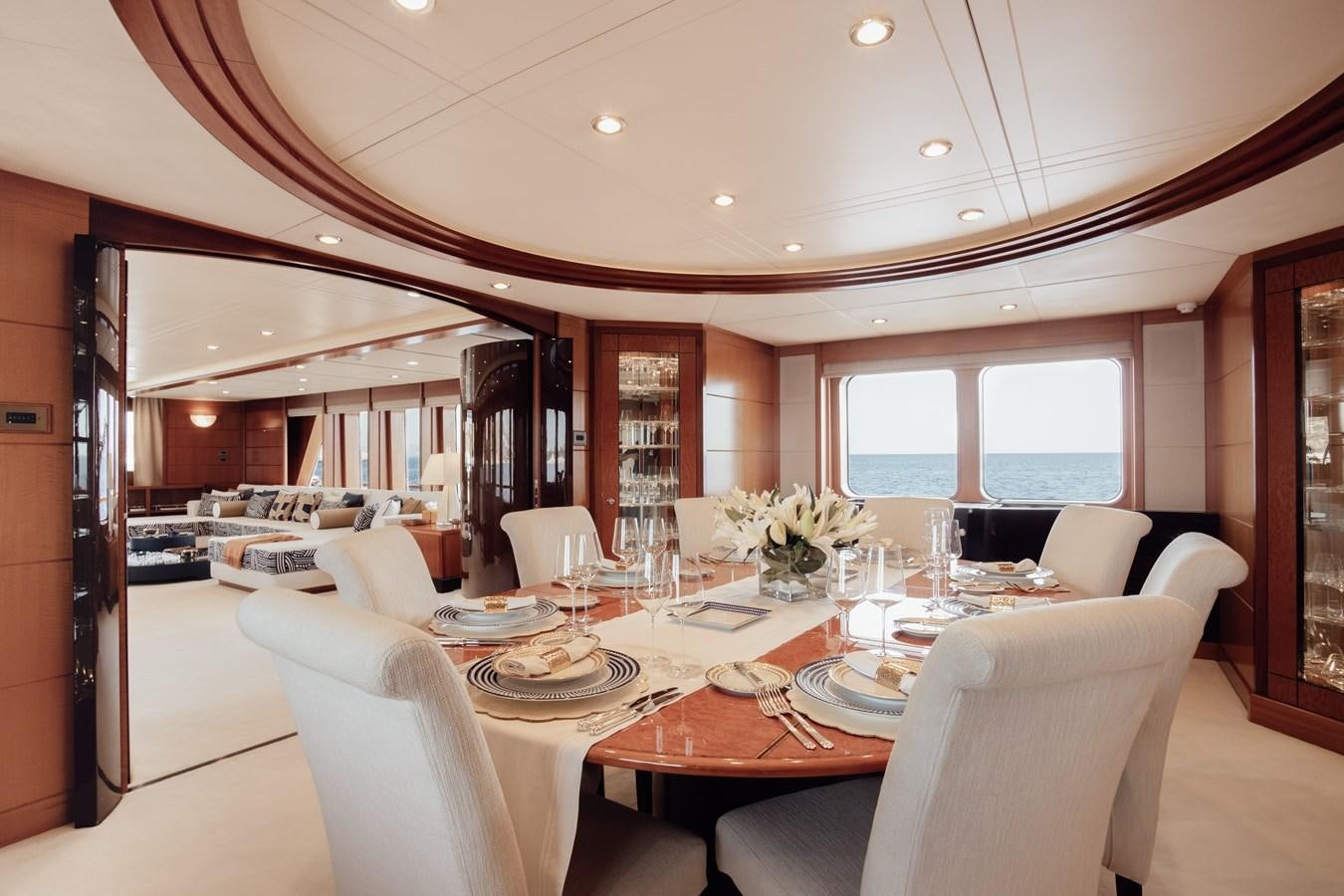 a large dining room with a large table and chairs aboard HERCULES Yacht for Sale