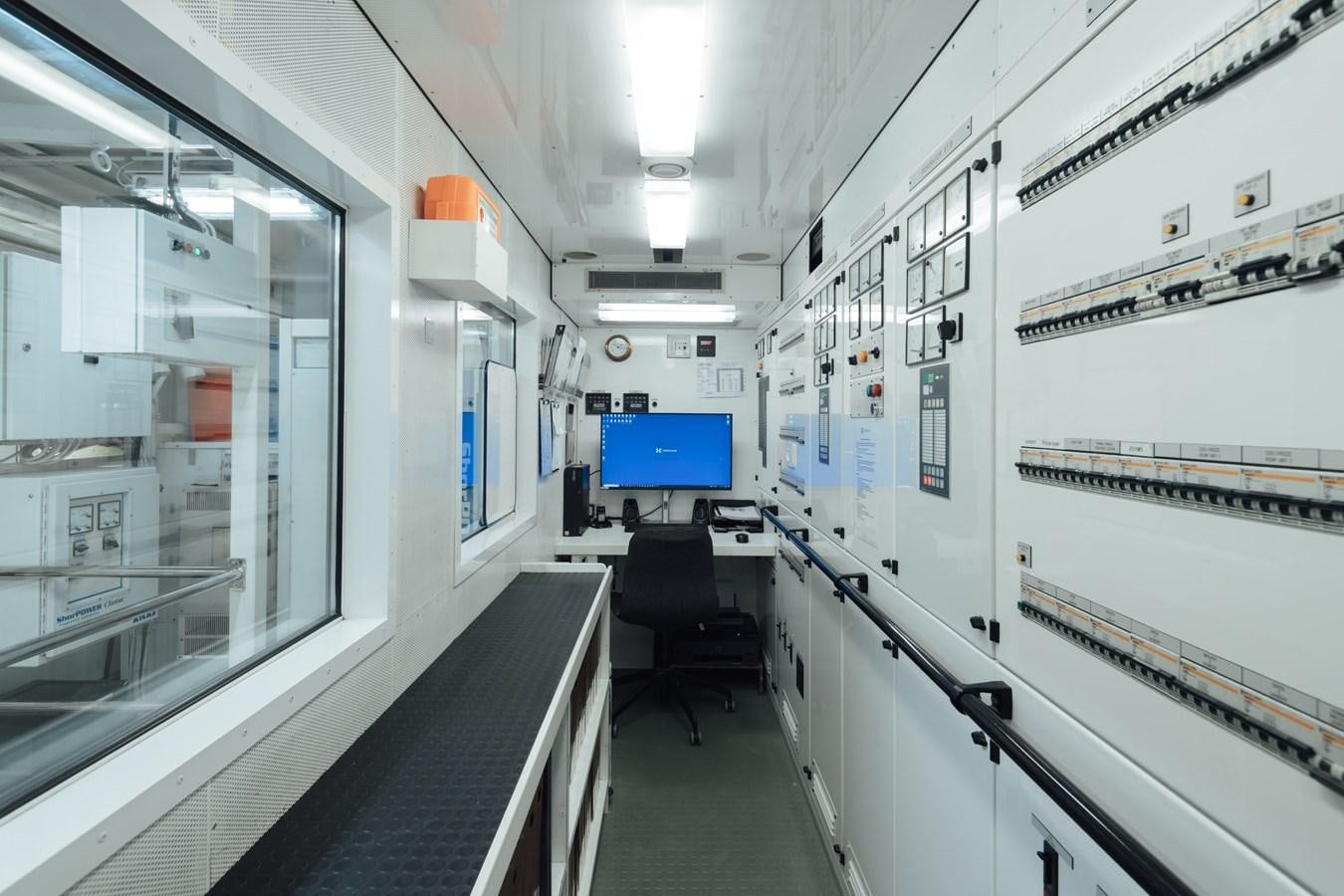 a room with several white cabinets aboard HERCULES Yacht for Sale