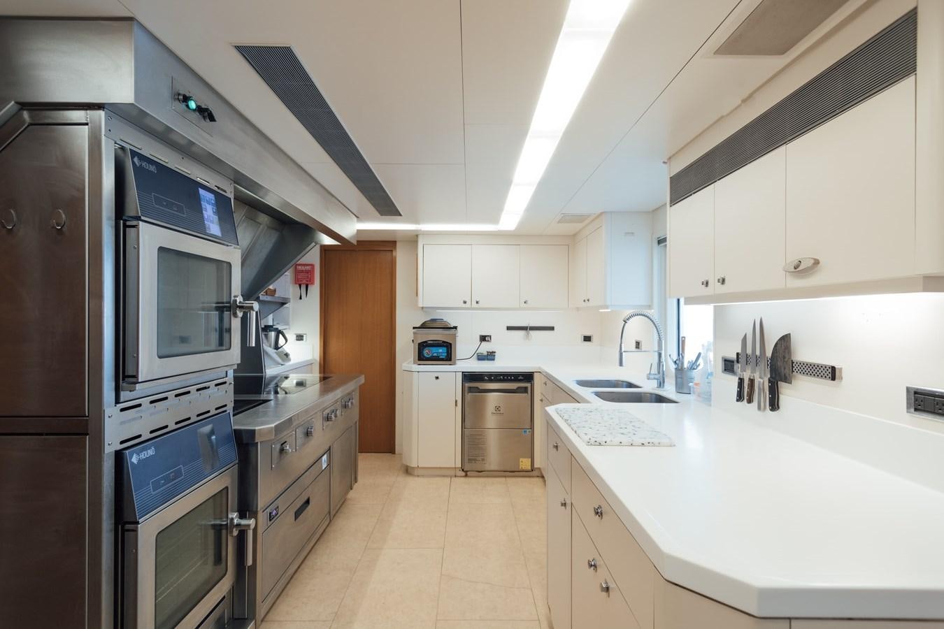 a kitchen with a stove and oven aboard HERCULES Yacht for Sale