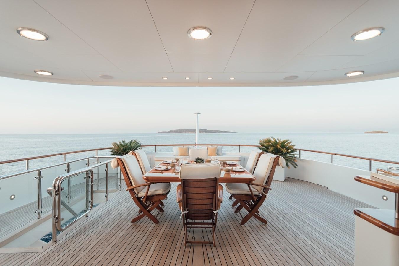 a room with a table and chairs aboard HERCULES Yacht for Sale