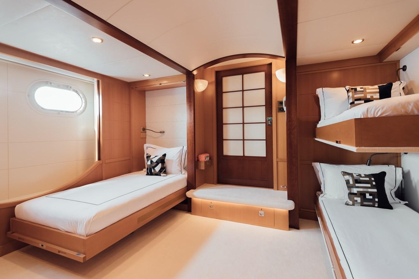 a room with a bed and a mirror aboard HERCULES Yacht for Sale
