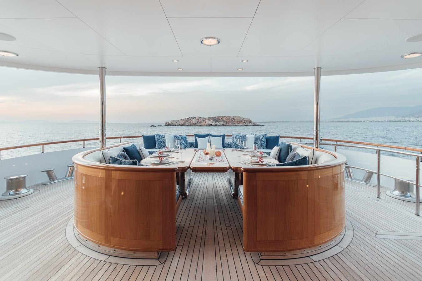a table on a deck aboard HERCULES Yacht for Sale