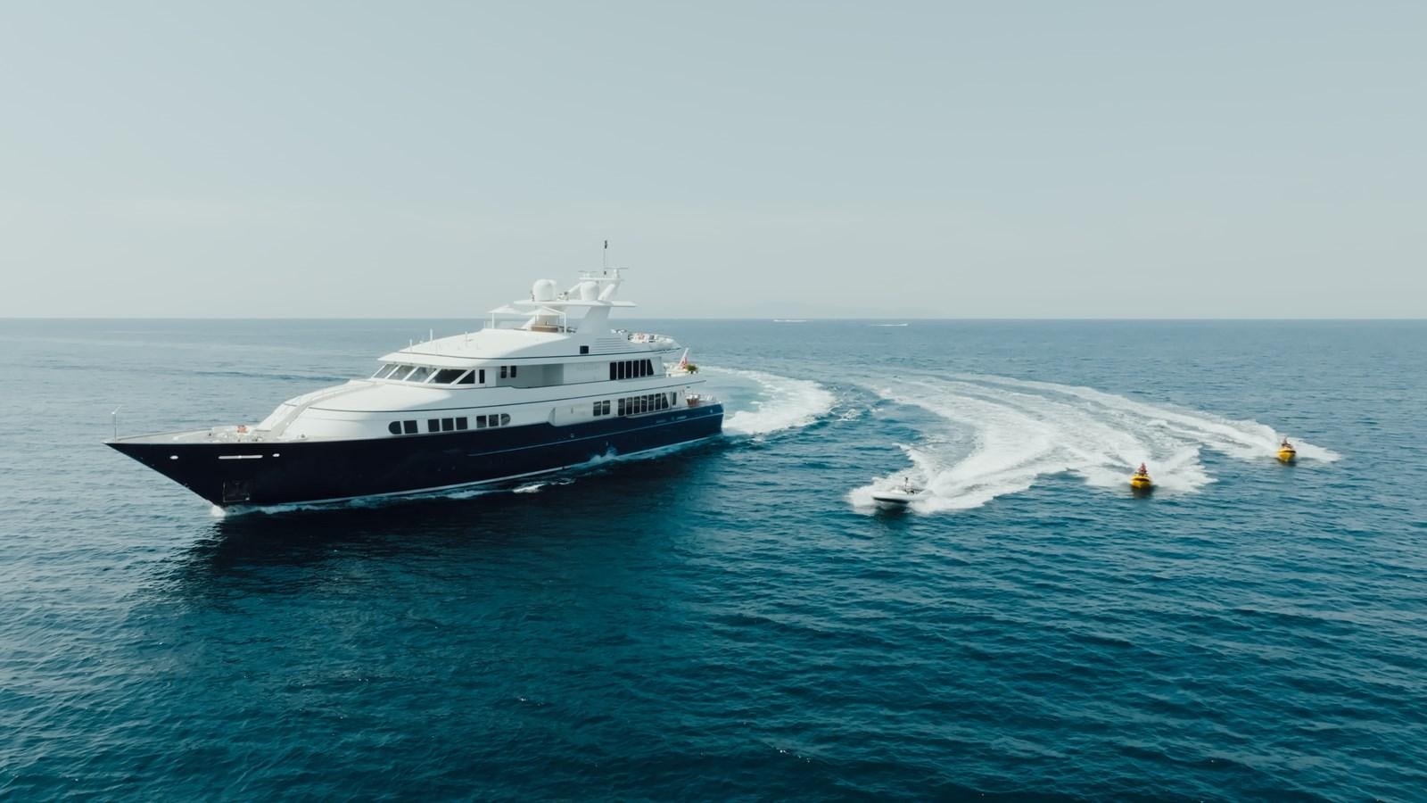 a couple of boats in the water aboard HERCULES Yacht for Sale