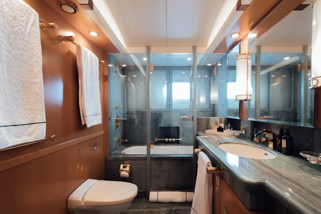 a bathroom with a glass shower aboard HERCULES Yacht for Sale