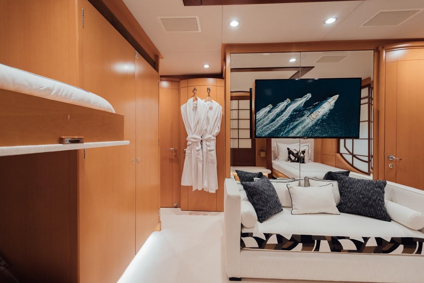 a room with a bed and a television aboard HERCULES Yacht for Sale