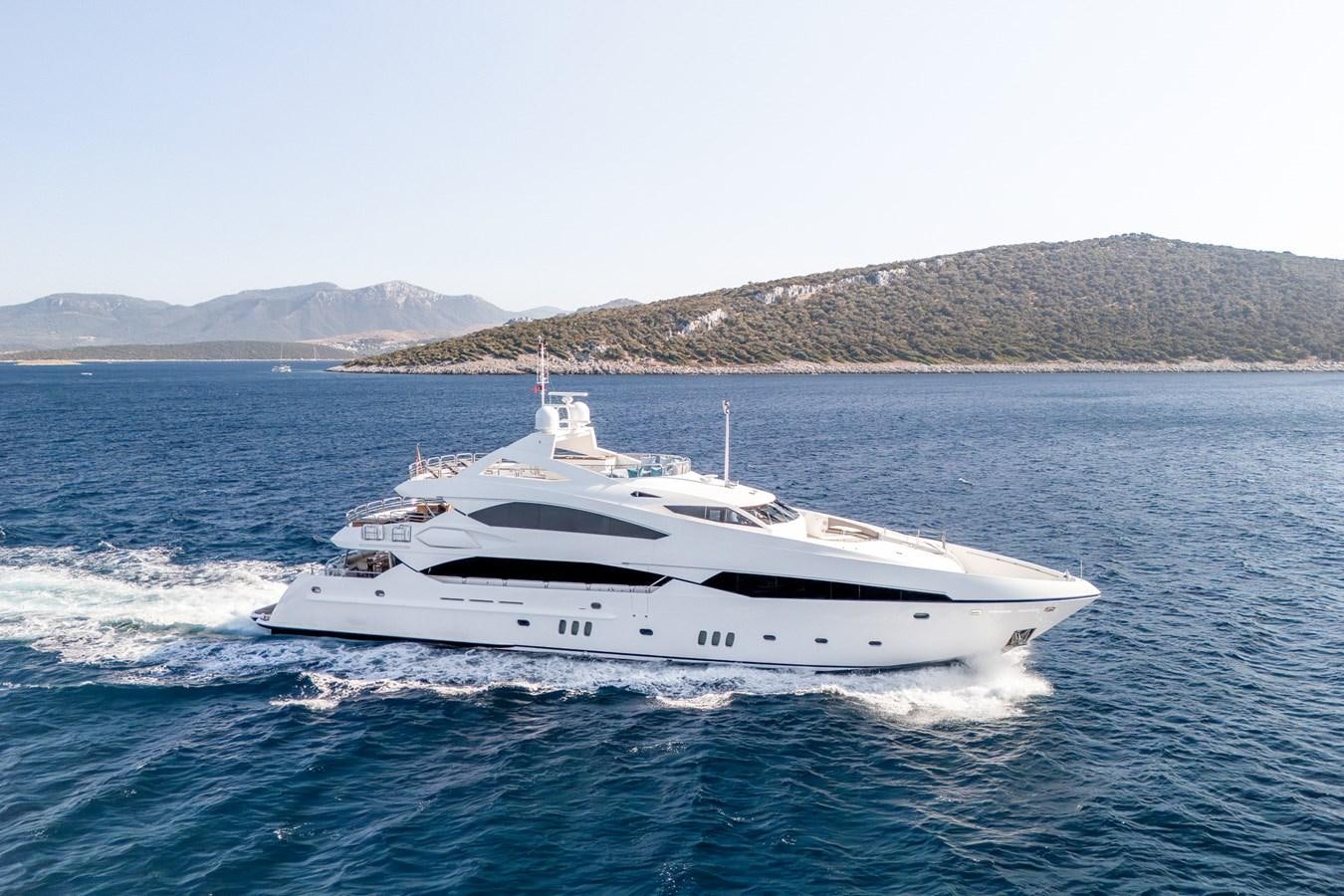 a white yacht on the water aboard IMAN Yacht for Sale