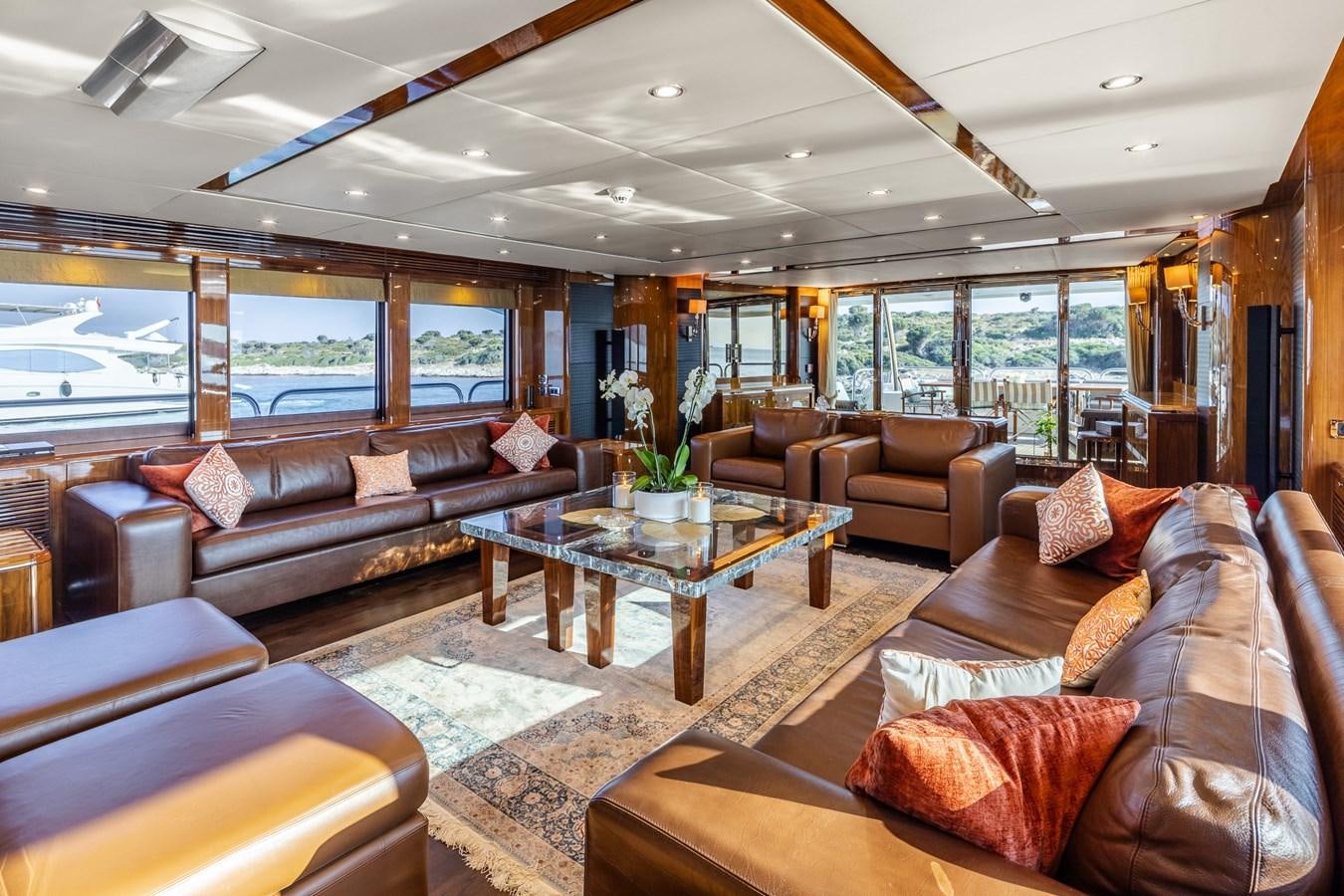 a living room with a large glass window aboard IMAN Yacht for Sale