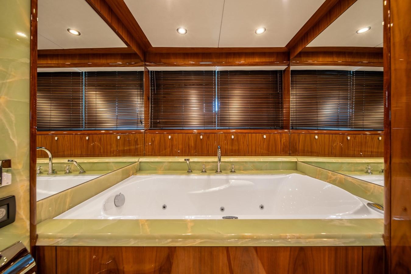 a bathroom with a large bathtub aboard IMAN Yacht for Sale