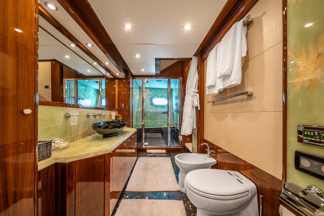 a bathroom with a glass shower aboard IMAN Yacht for Sale