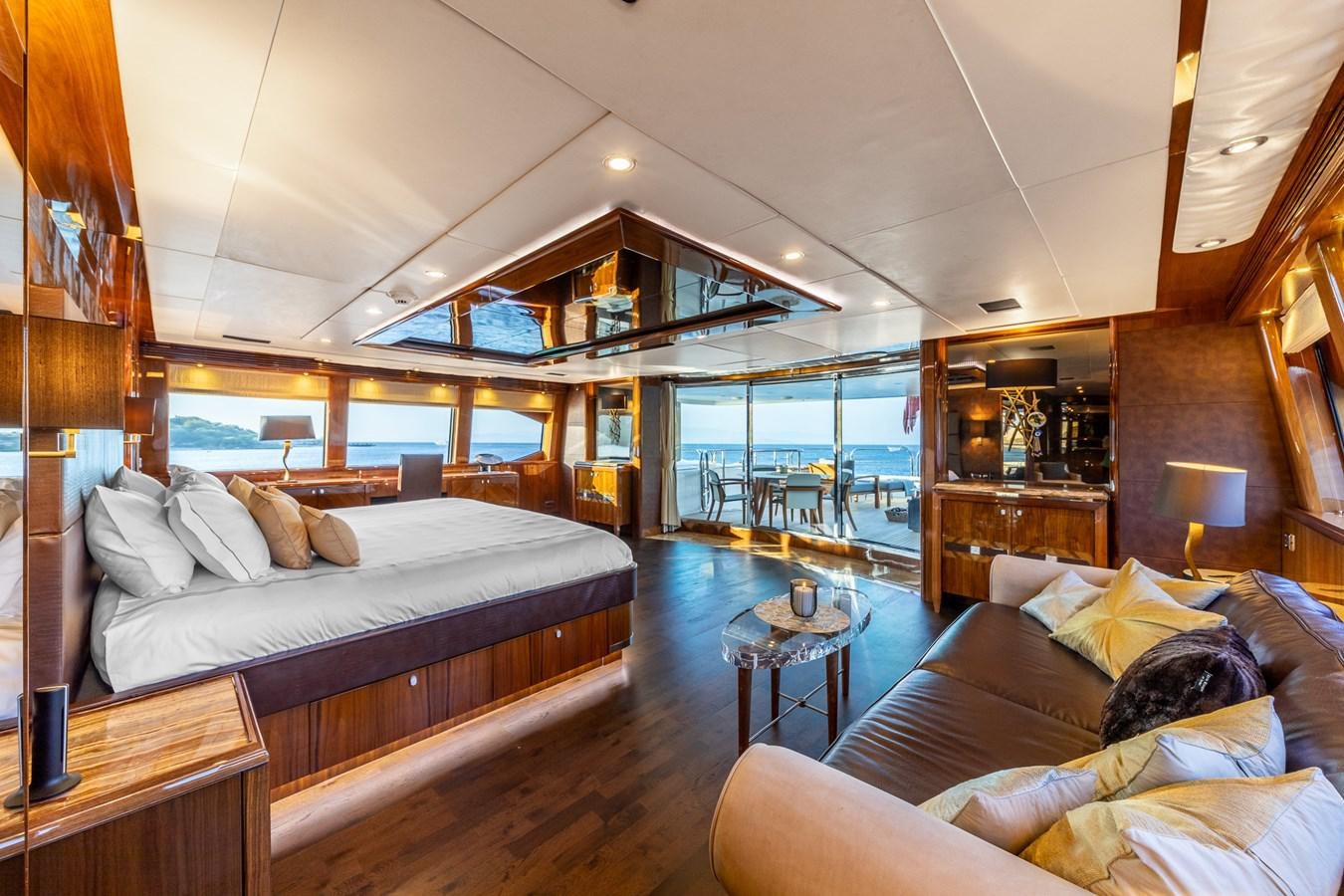 a large bedroom with a large bed aboard IMAN Yacht for Sale