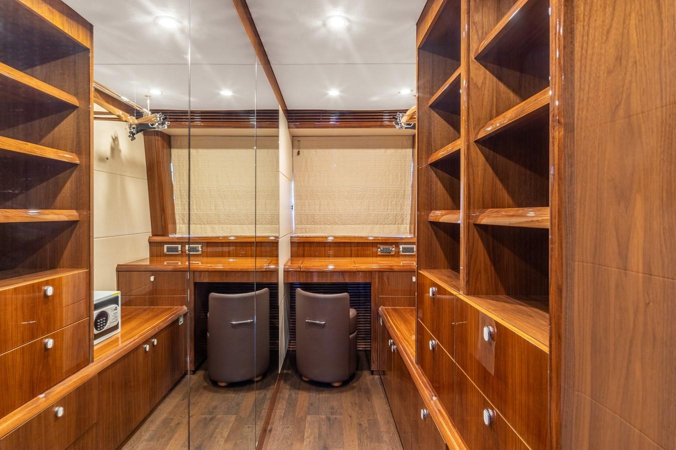 a room with wooden cabinets and a toilet aboard IMAN Yacht for Sale