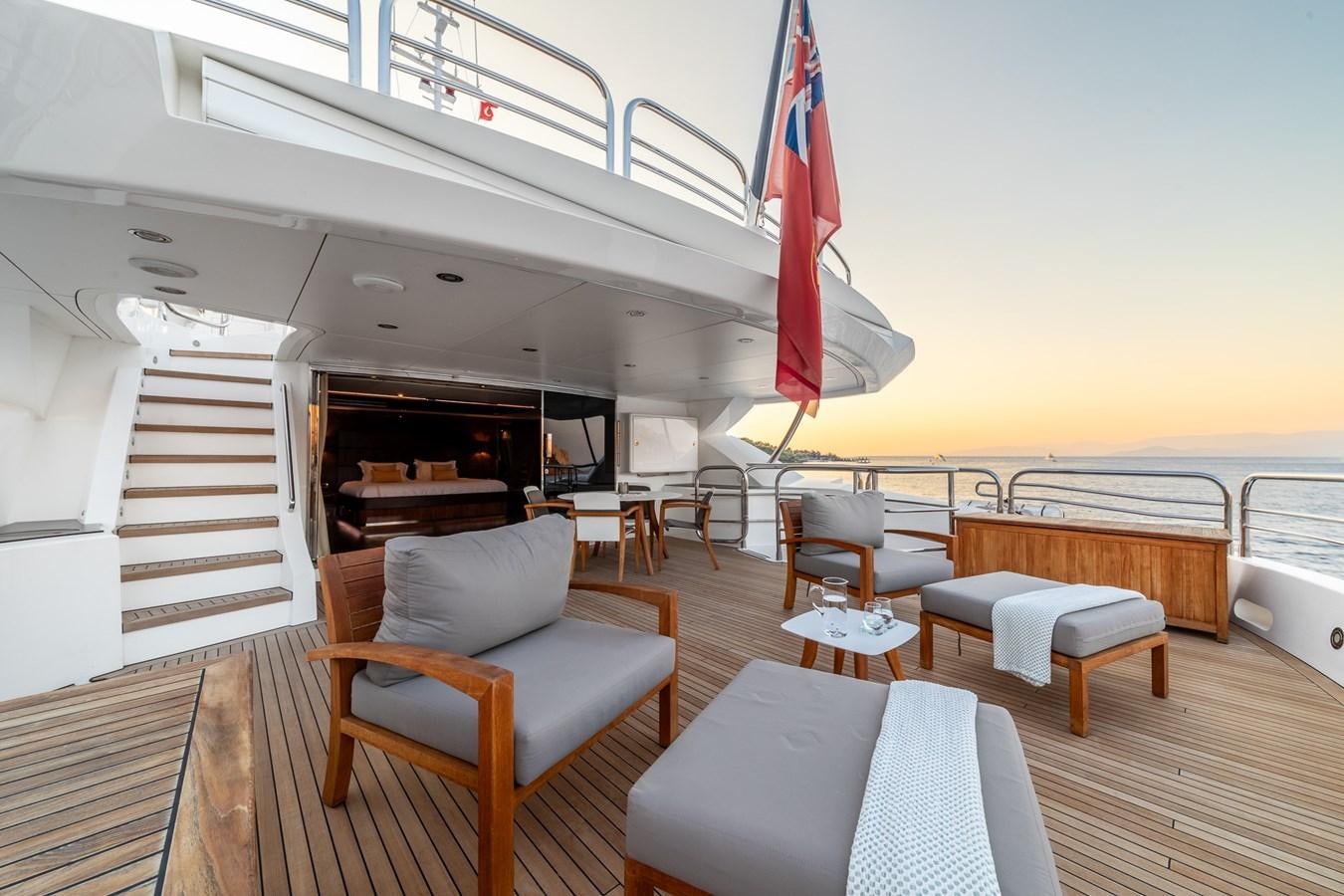 a room with chairs and a table aboard IMAN Yacht for Sale