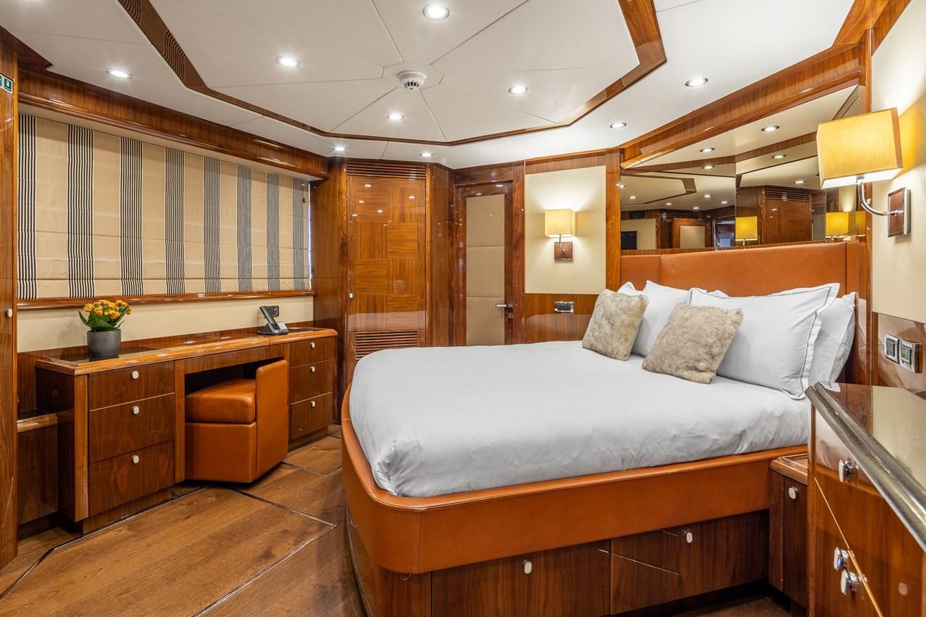 a large bed in a room aboard IMAN Yacht for Sale