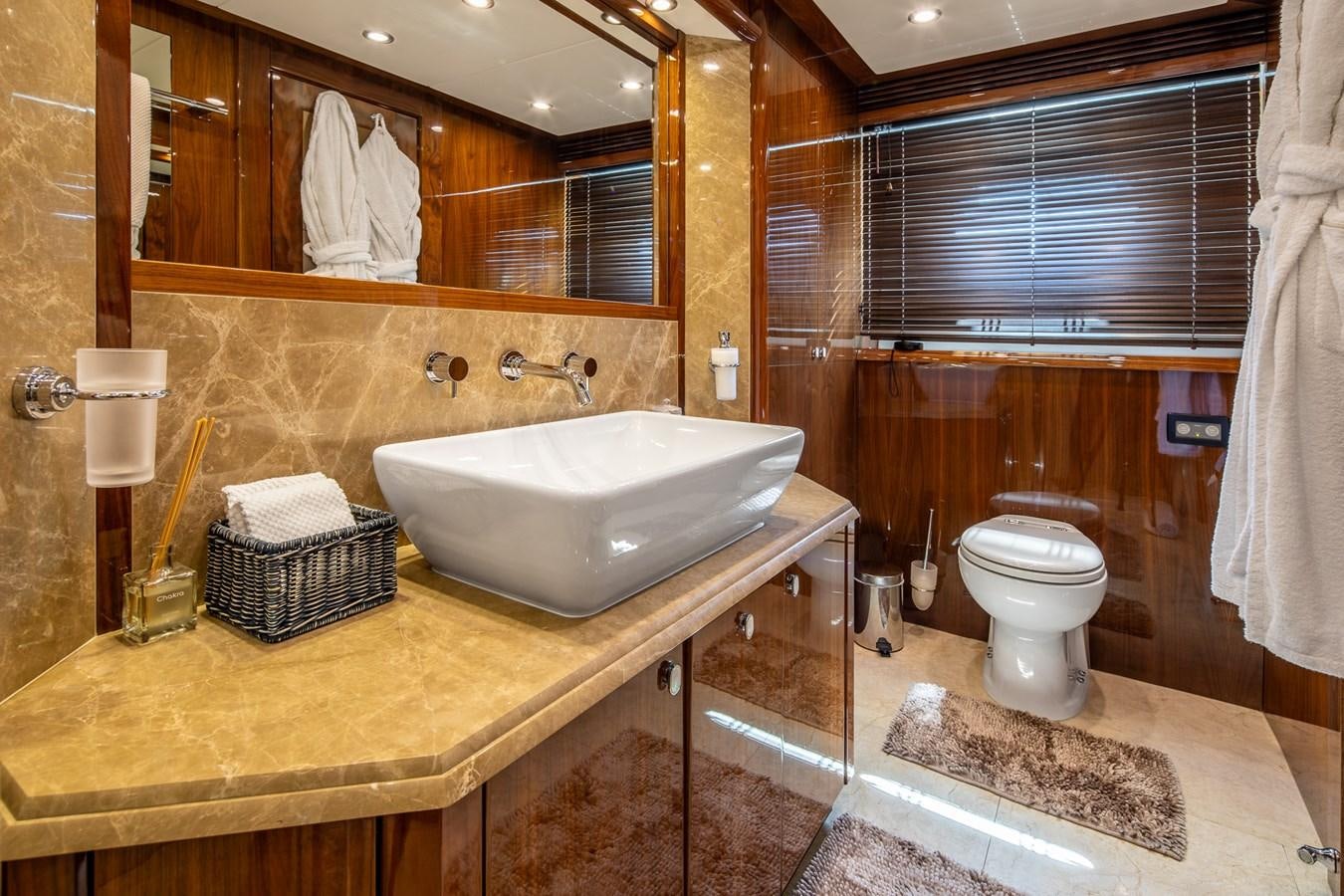 a bathroom with a sink and toilet aboard IMAN Yacht for Sale