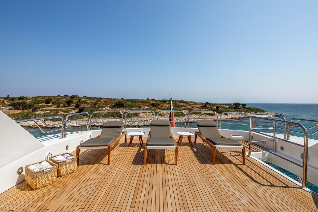 a deck with benches on it aboard IMAN Yacht for Sale