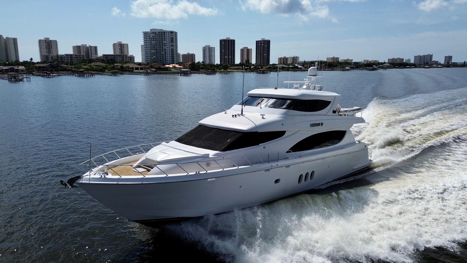 a white yacht on the water aboard DESTINY IV Yacht for Sale