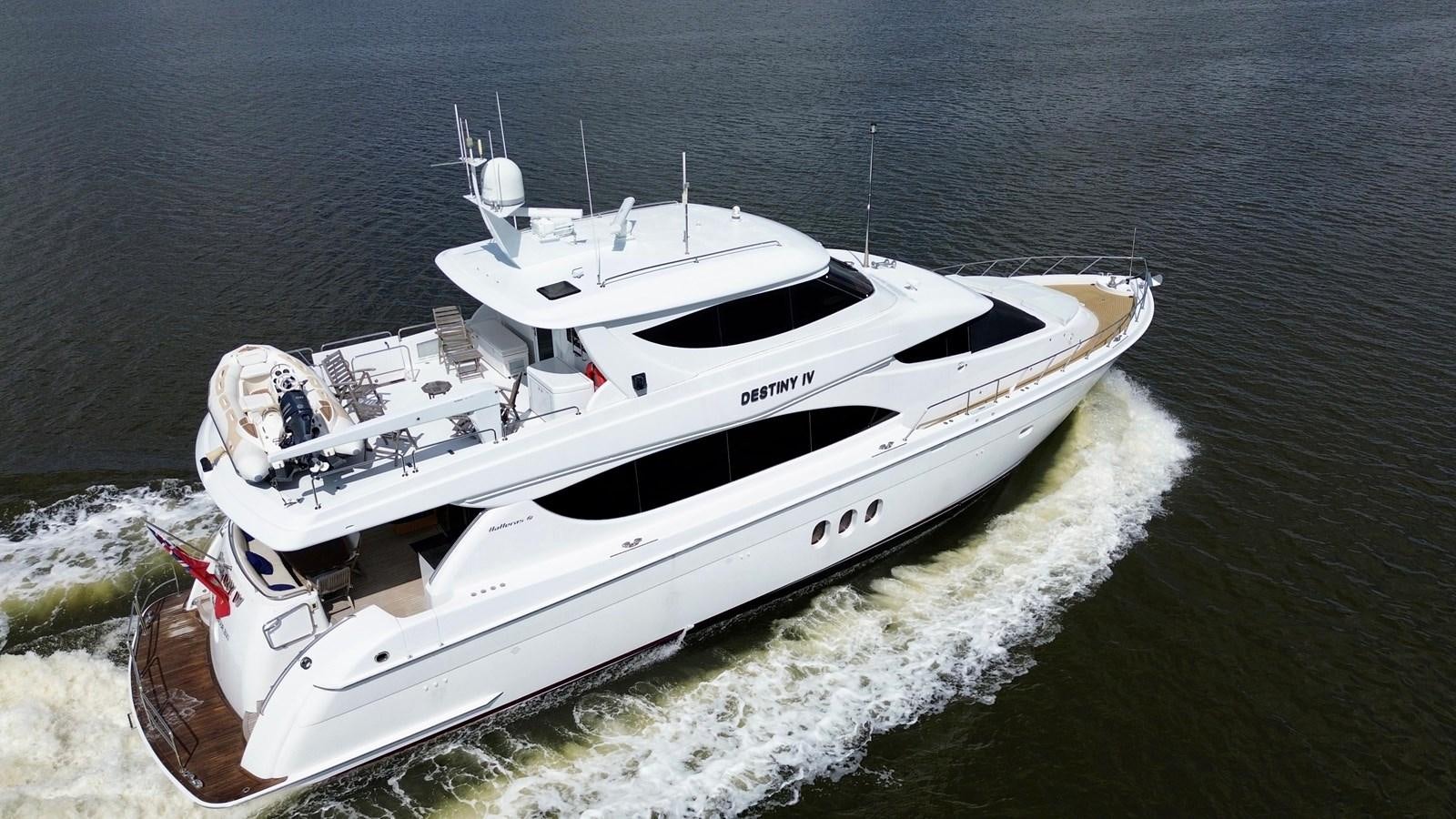 a white boat on the water aboard DESTINY IV Yacht for Sale
