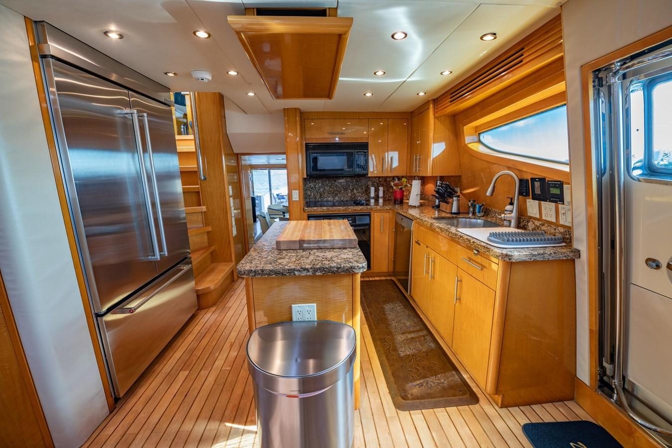 a kitchen with a bar and a bar aboard DESTINY IV Yacht for Sale