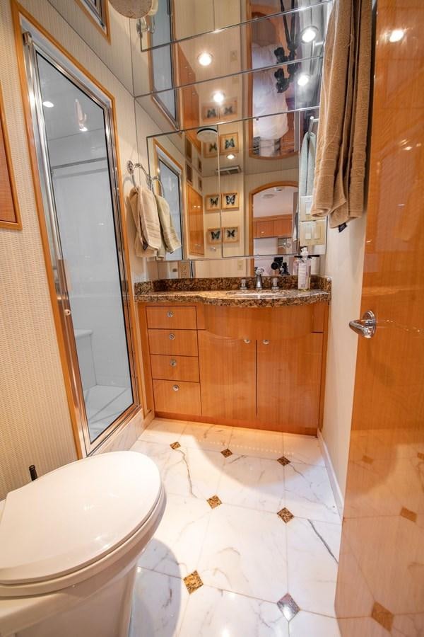 a bathroom with a toilet and a sink aboard DESTINY IV Yacht for Sale