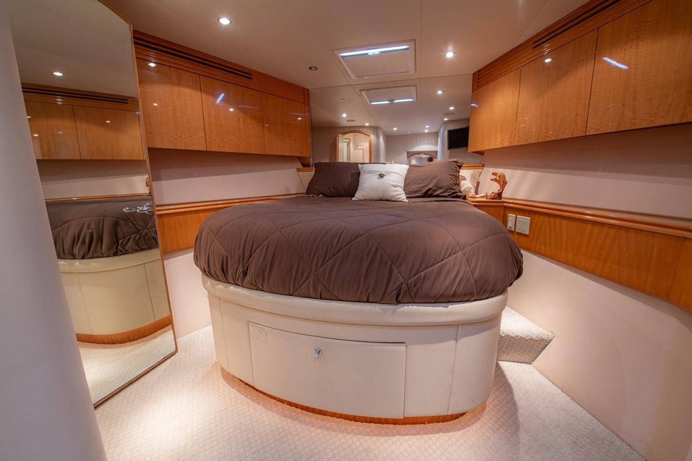 a bed in a room aboard DESTINY IV Yacht for Sale