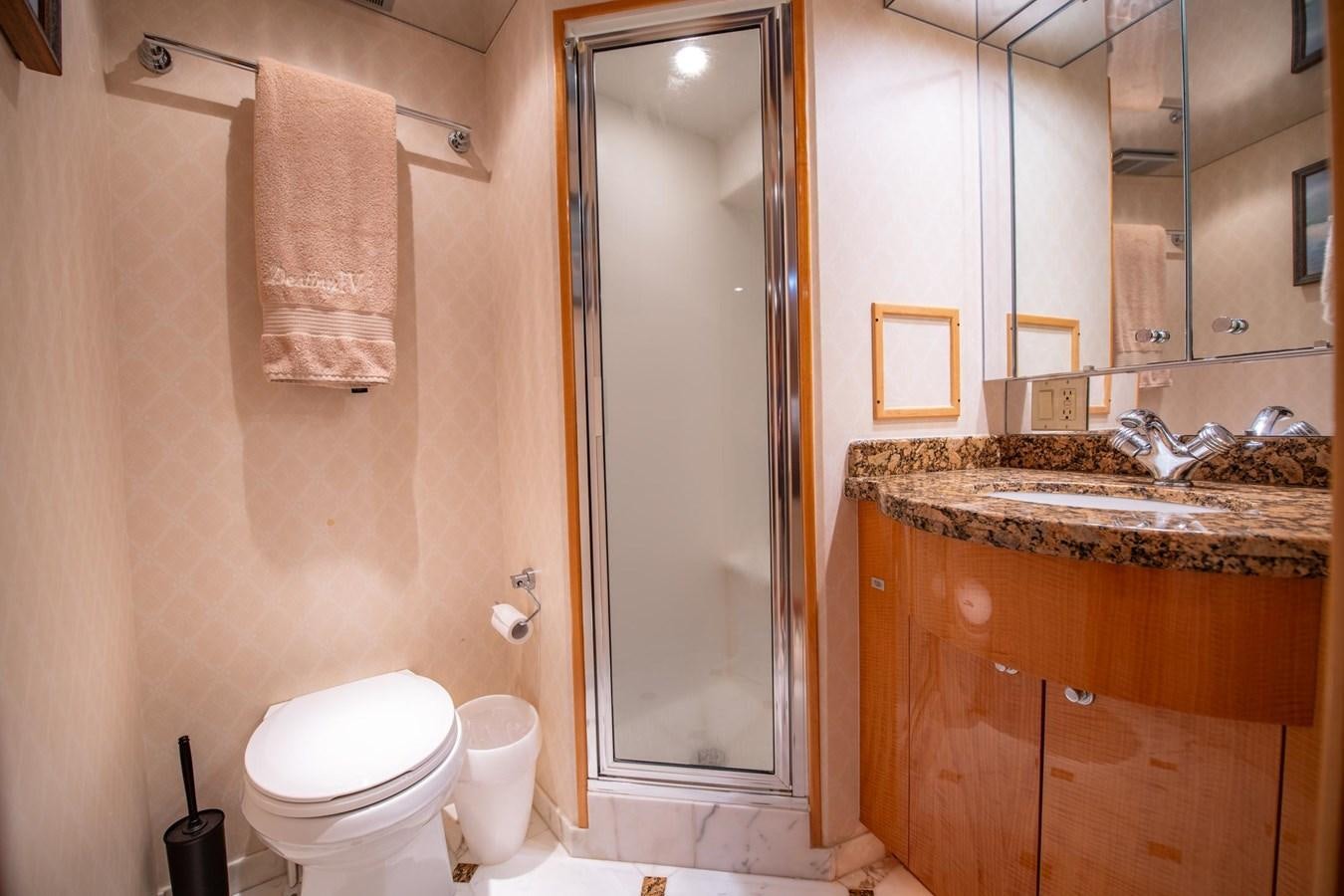 a bathroom with a sink toilet and a shower aboard DESTINY IV Yacht for Sale