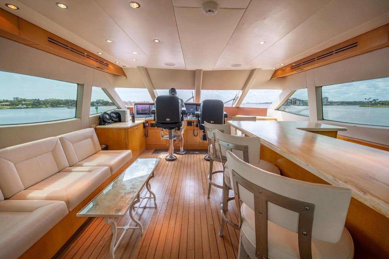 a room with a couch and a television aboard DESTINY IV Yacht for Sale