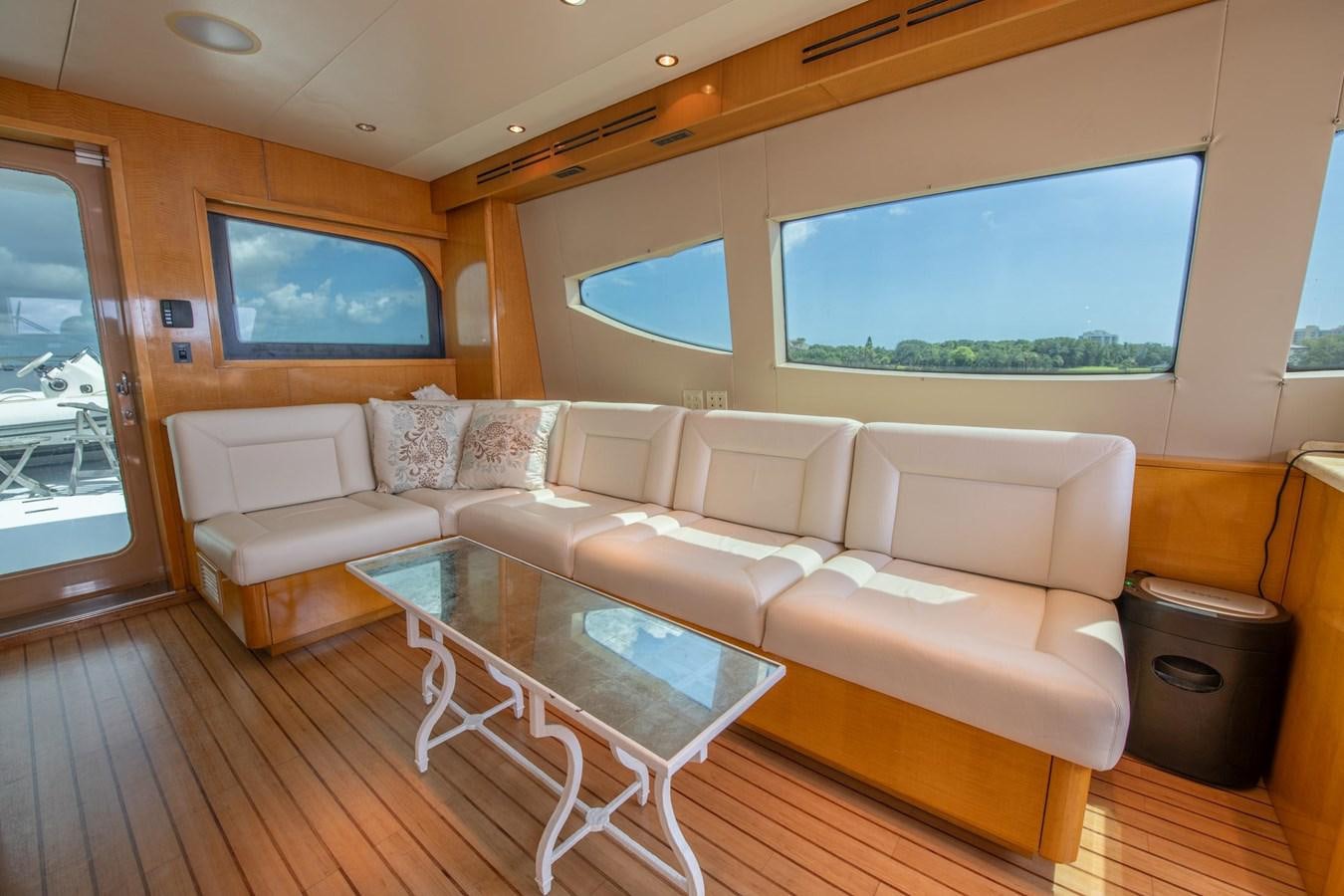 a living room with a couch and a coffee table aboard DESTINY IV Yacht for Sale