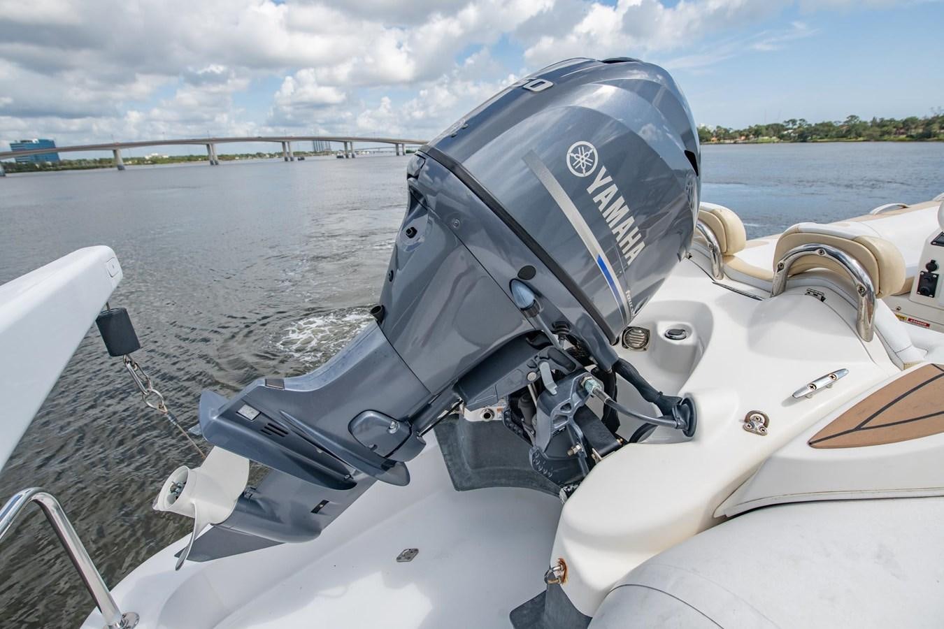 a boat with a motor and steering wheel on it aboard DESTINY IV Yacht for Sale