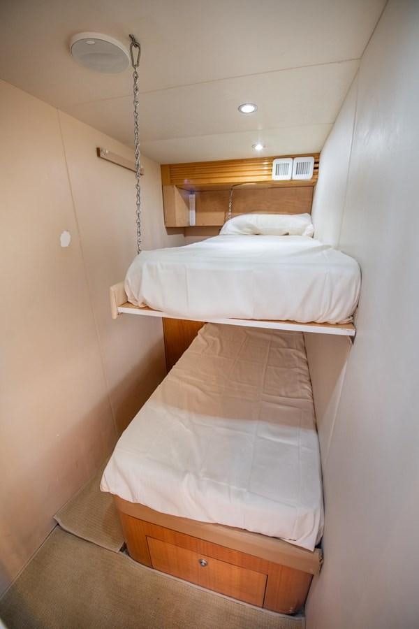 a couple of beds in a room aboard DESTINY IV Yacht for Sale