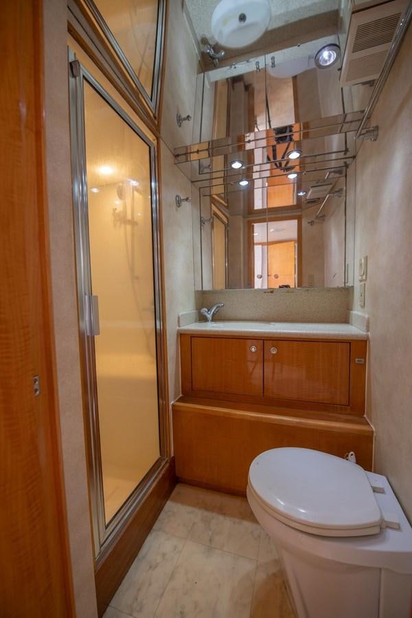 a bathroom with a toilet and a sink aboard DESTINY IV Yacht for Sale
