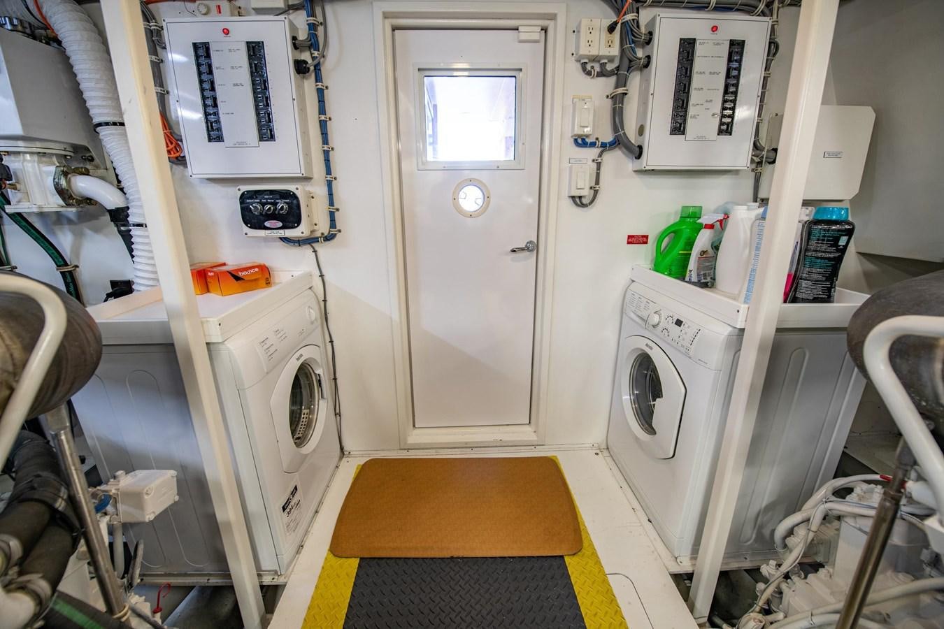 a room with a machine aboard DESTINY IV Yacht for Sale