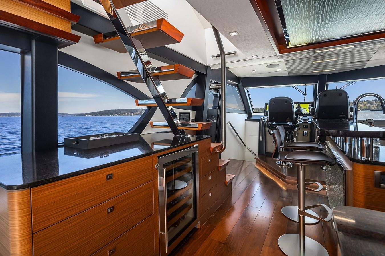 a boat with a desk and chairs aboard THRU & THRU Yacht for Sale
