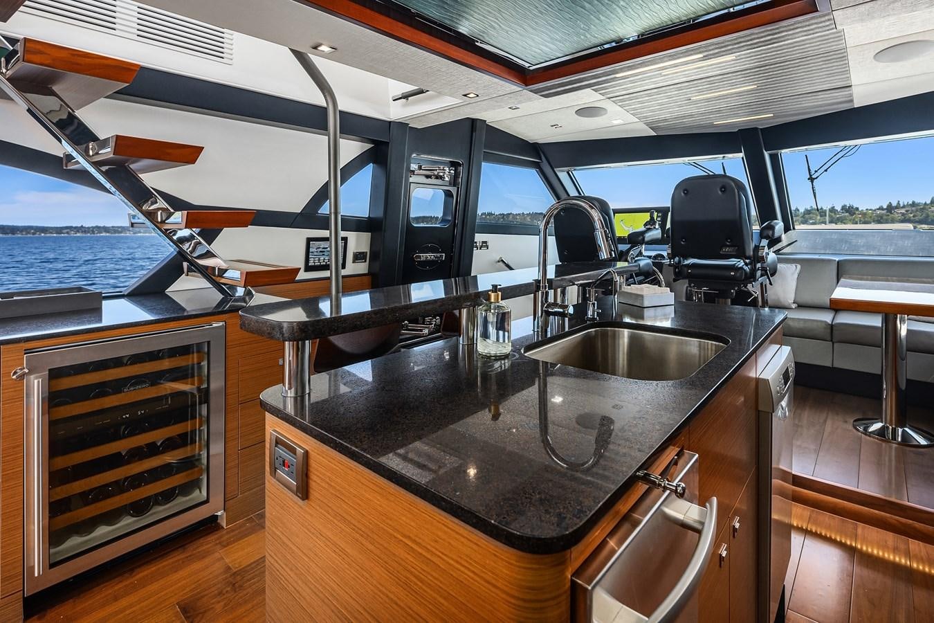 a kitchen with a sink and a grill aboard THRU & THRU Yacht for Sale