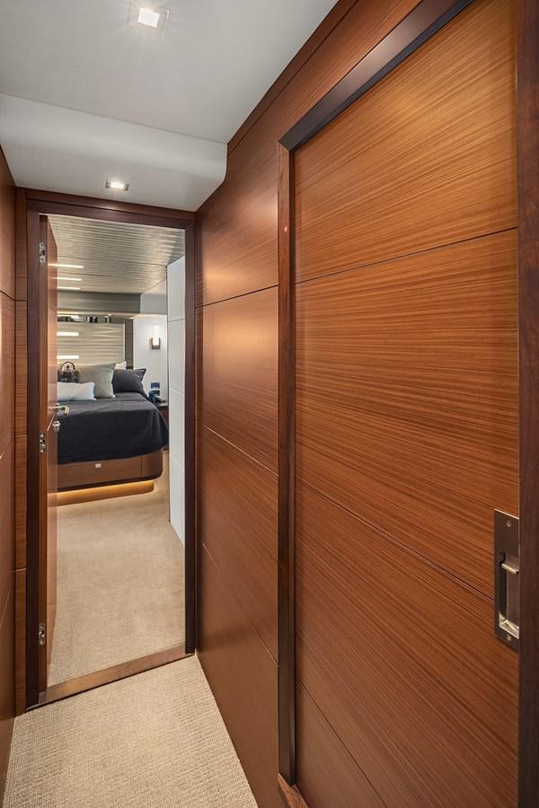 a room with a wood wall aboard THRU & THRU Yacht for Sale