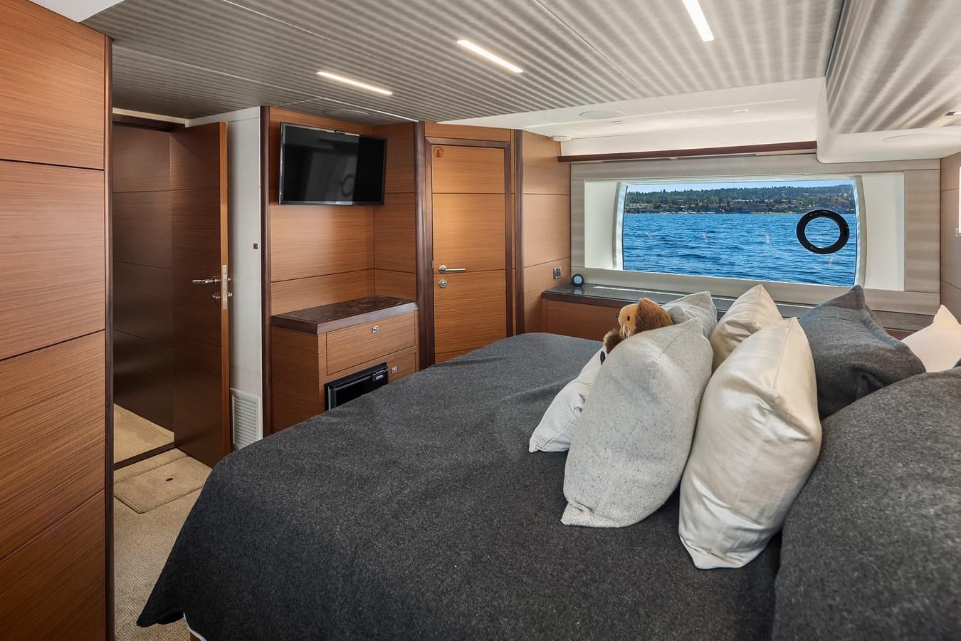 a person lying on a bed aboard THRU & THRU Yacht for Sale