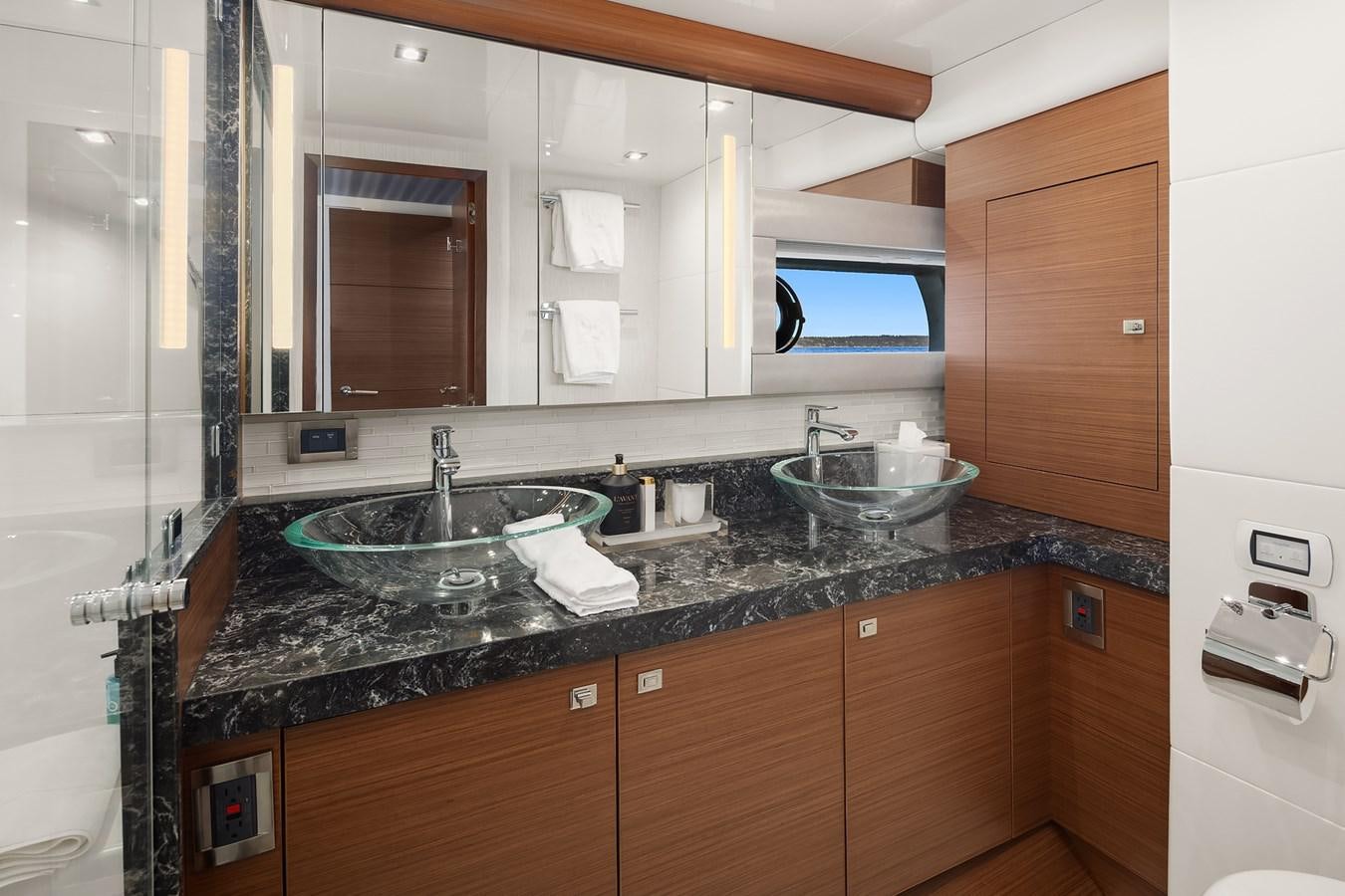 a bathroom with a sink and a mirror aboard THRU & THRU Yacht for Sale