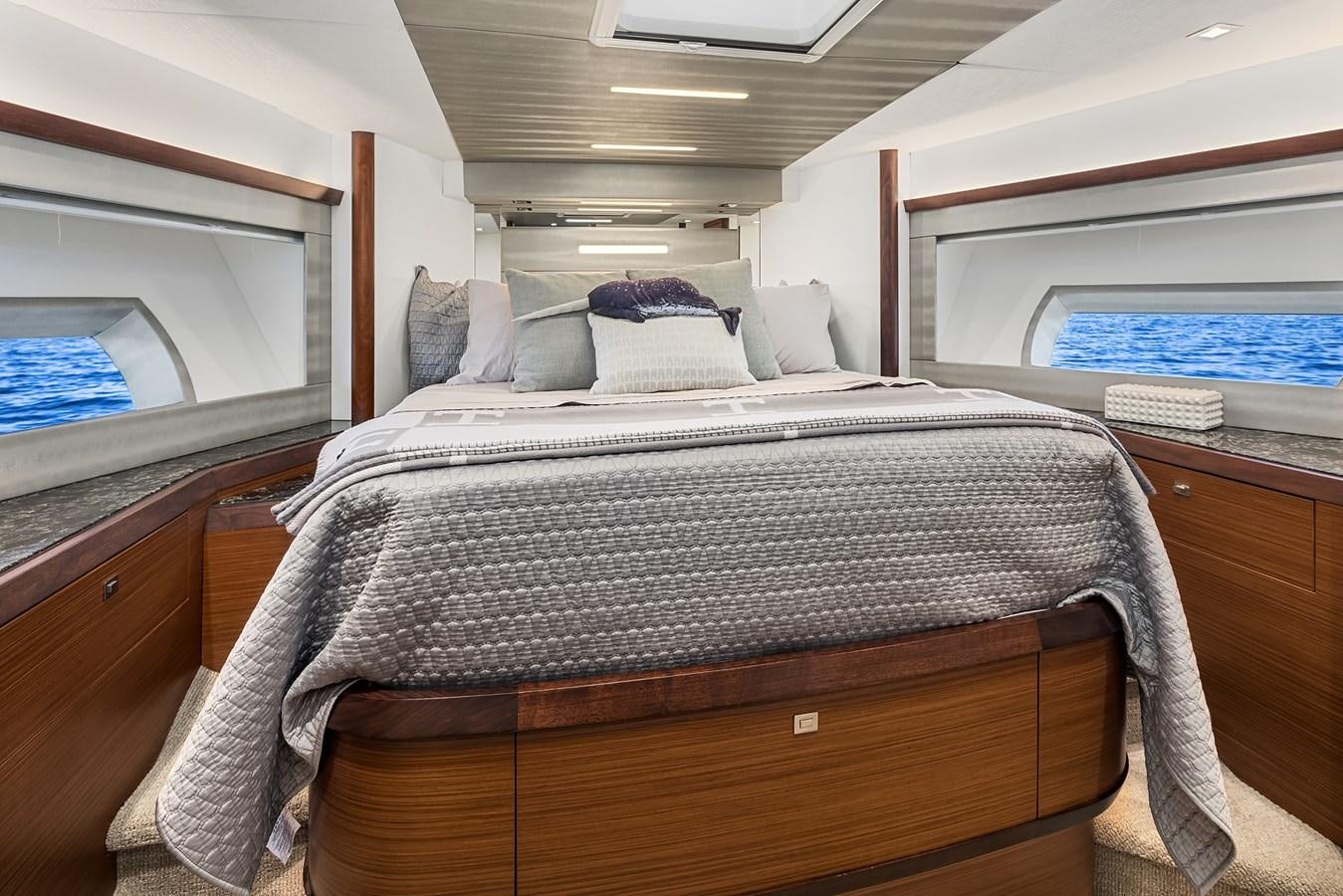 a bed with a black comforter aboard THRU & THRU Yacht for Sale
